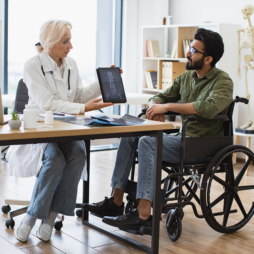 Clinician meeting with a patient who uses a wheelchair